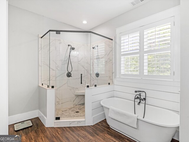 bathroom featuring separate shower and tub, hardwood / wood-style flooring, and plenty of natural light