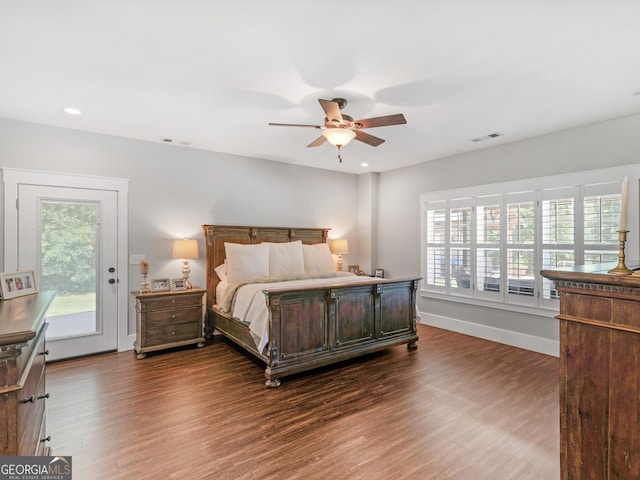 bedroom featuring access to outside, dark hardwood / wood-style floors, and ceiling fan