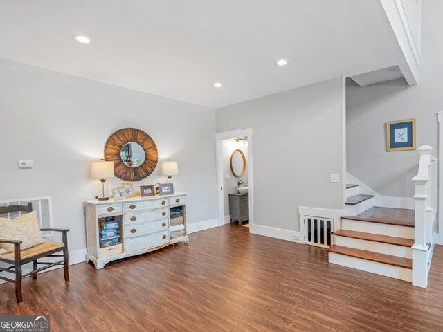 sitting room with dark hardwood / wood-style floors