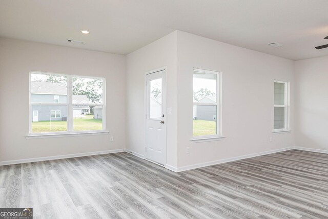 entryway with ceiling fan and light wood-type flooring