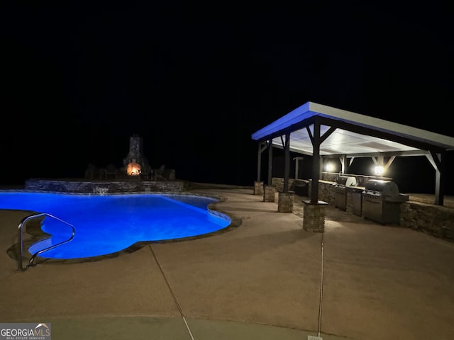 pool at twilight with a patio