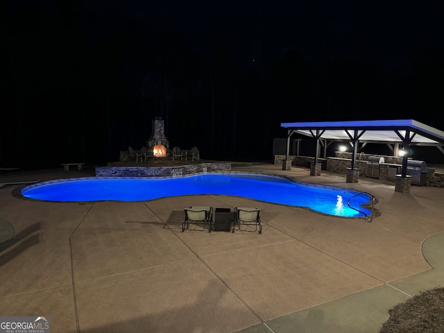 pool at night with a patio