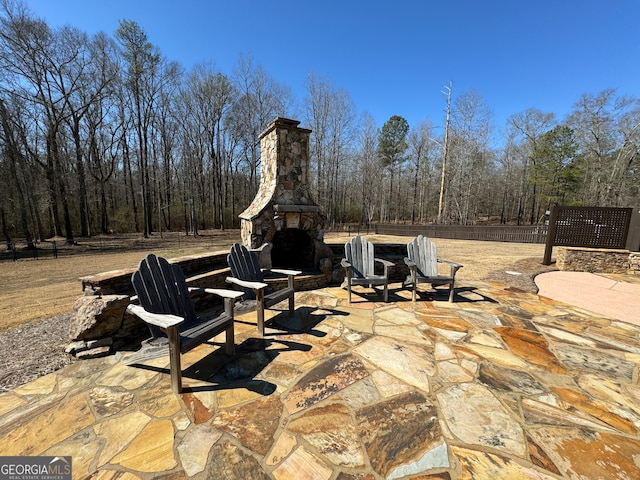 view of patio / terrace with an outdoor stone fireplace