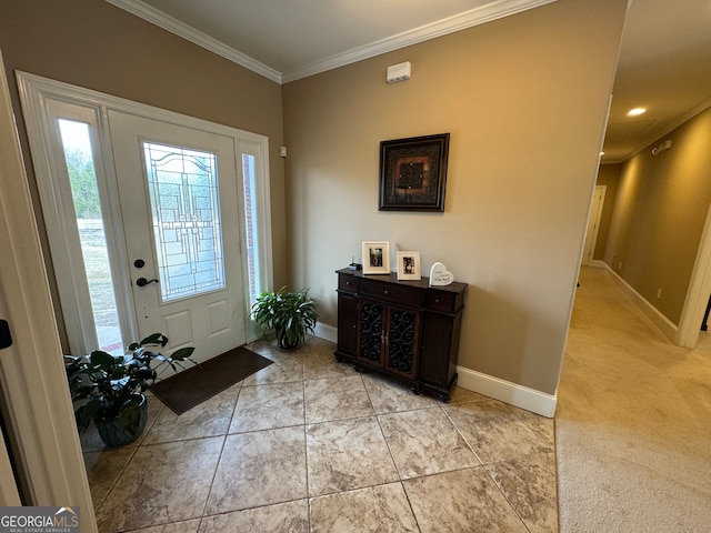 entryway featuring crown molding and light colored carpet