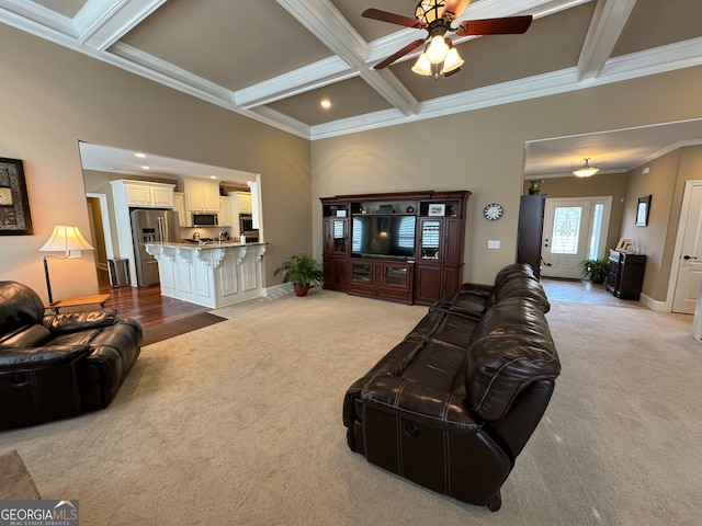 living room featuring coffered ceiling, beam ceiling, light colored carpet, and ceiling fan