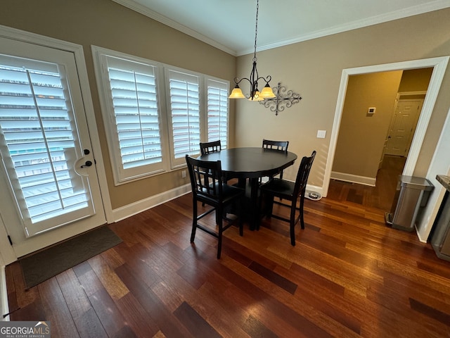 dining space with a notable chandelier, a wealth of natural light, and dark wood-type flooring