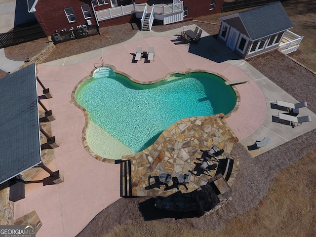 view of pool featuring a patio area