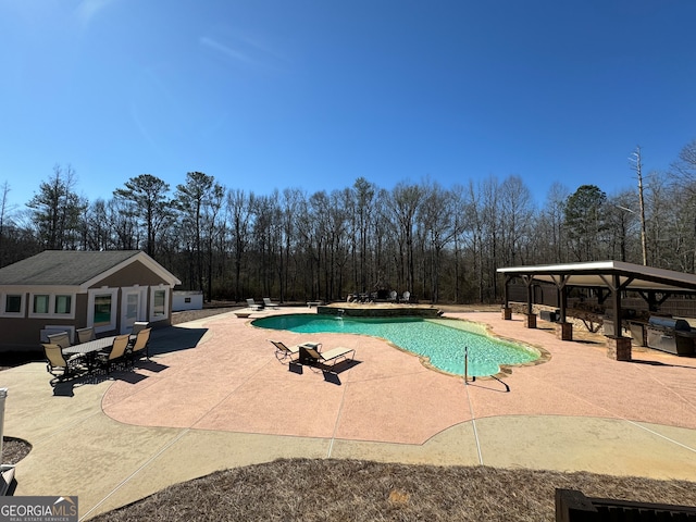 view of pool featuring a diving board, a gazebo, and a patio