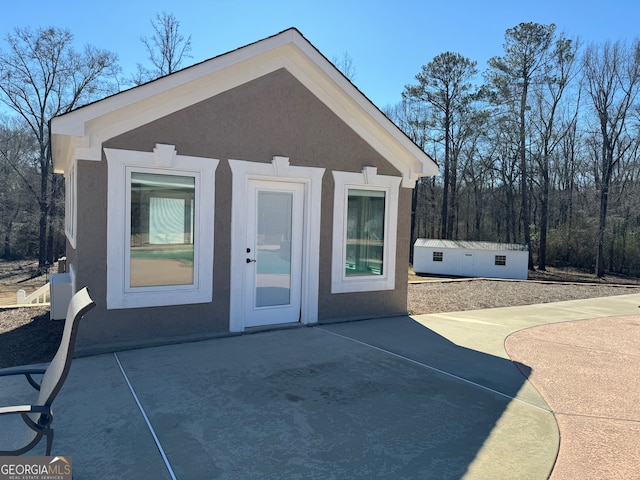 back of property featuring a patio