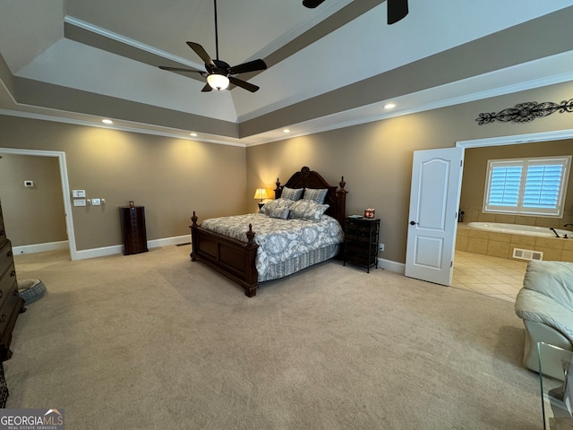 carpeted bedroom featuring ceiling fan, a raised ceiling, and crown molding