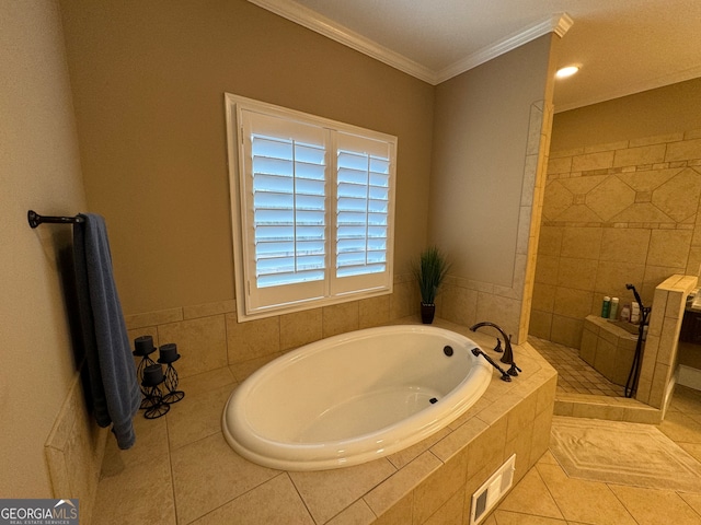 bathroom with tile floors, crown molding, and plus walk in shower