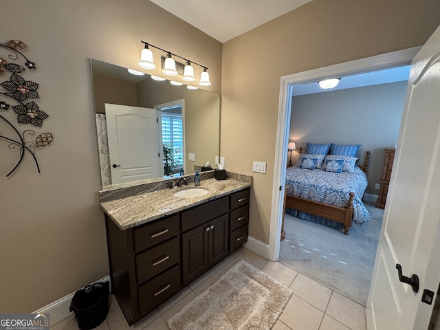 bathroom featuring tile floors and vanity