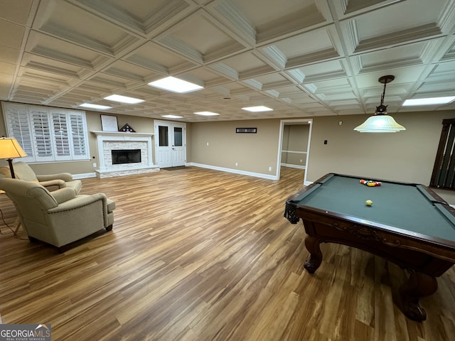 rec room featuring pool table, hardwood / wood-style flooring, and a fireplace