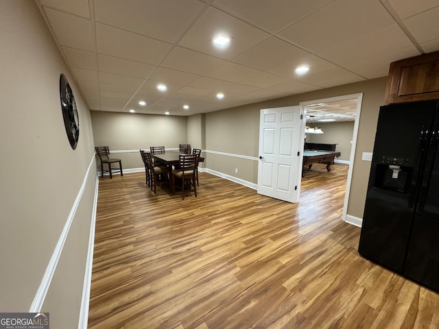 dining area featuring a paneled ceiling, billiards, and hardwood / wood-style flooring