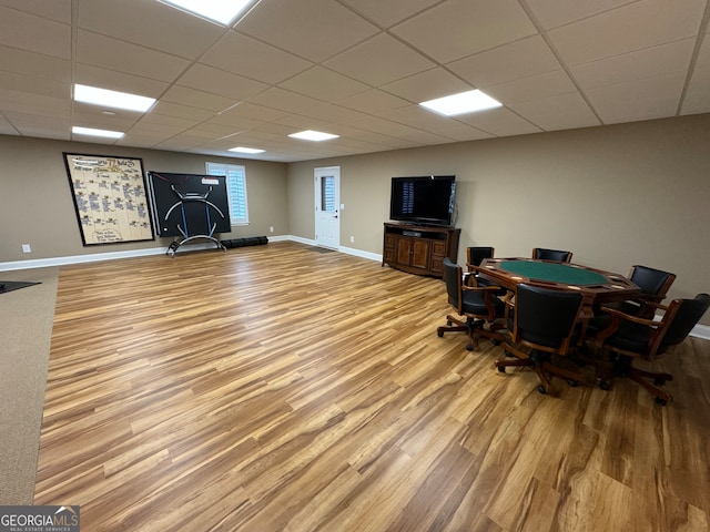 office area with a paneled ceiling and light wood-type flooring