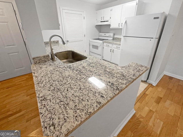 kitchen featuring sink, white cabinets, white appliances, and light hardwood / wood-style flooring