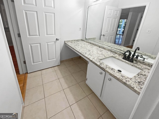 bathroom featuring tile patterned floors and vanity