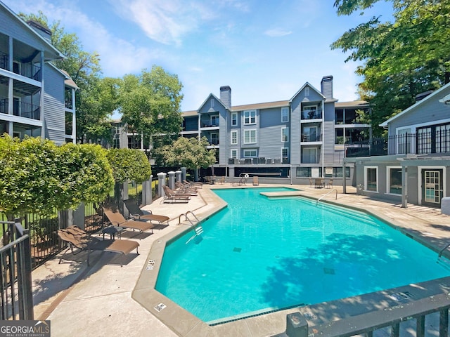 view of swimming pool with a patio