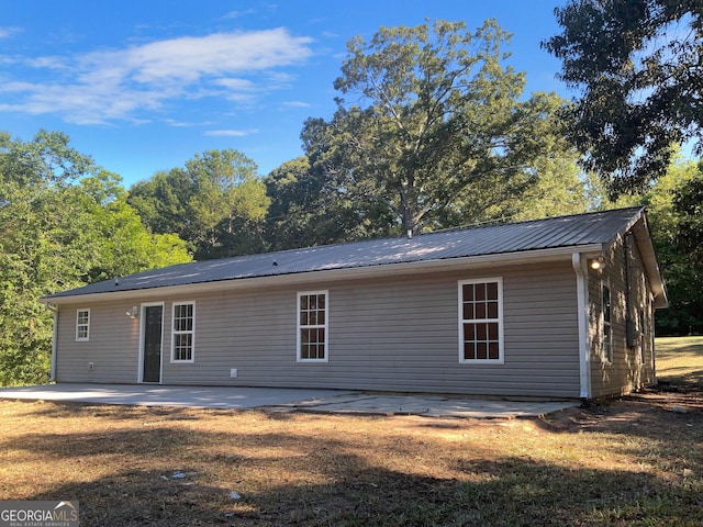 back of property with a patio area