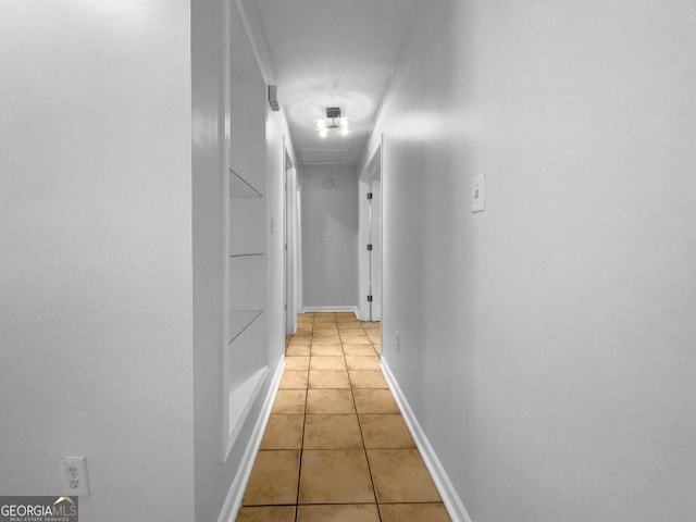 hallway with light tile patterned floors