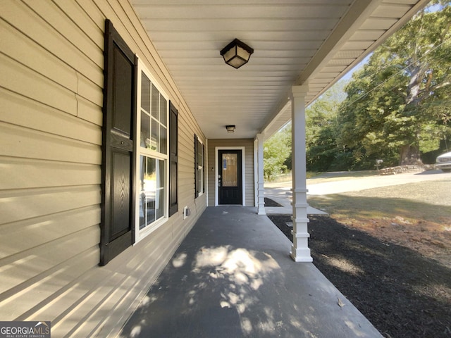 view of patio featuring a porch