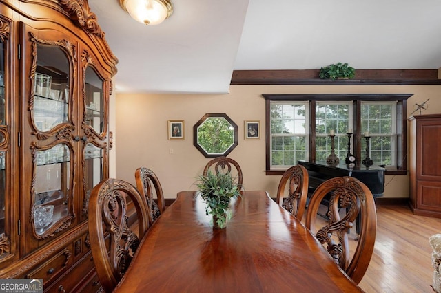 dining room with light wood-style flooring