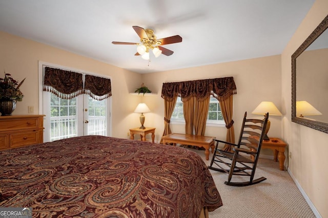 bedroom featuring access to outside, light carpet, and ceiling fan