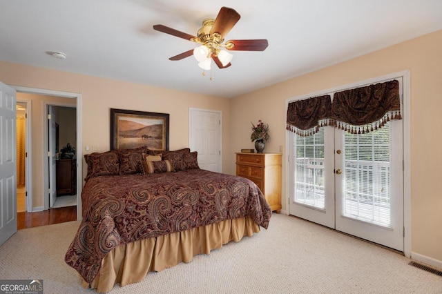 bedroom with ceiling fan, light carpet, french doors, and access to outside