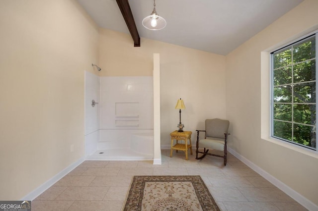 sitting room featuring light tile patterned floors, lofted ceiling with beams, and baseboards