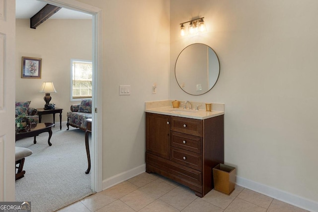 bathroom with lofted ceiling with beams, vanity, and tile patterned floors