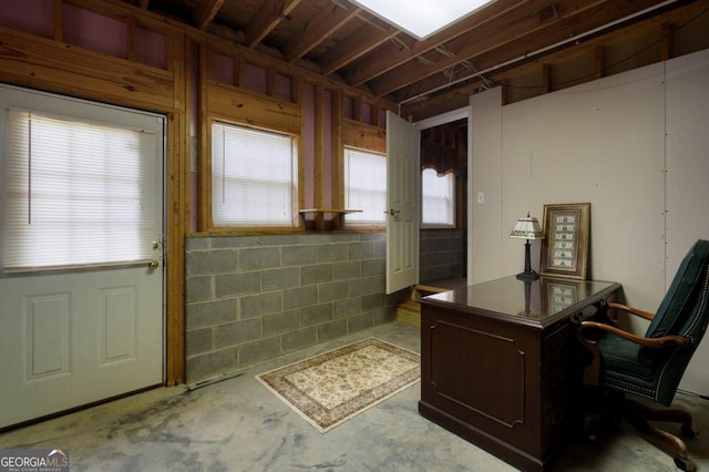 office area with concrete flooring