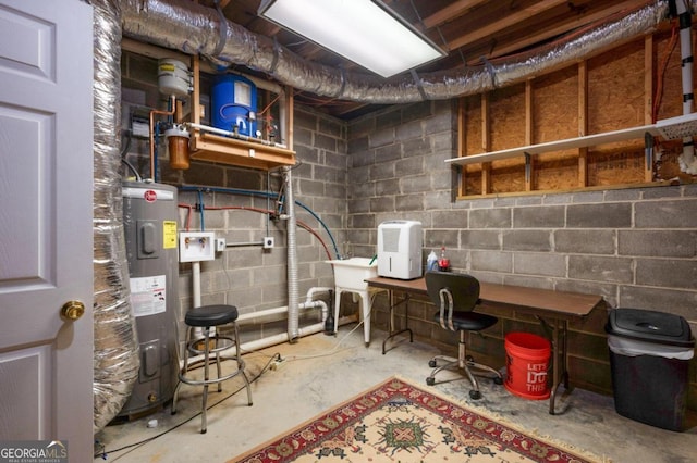 utility room with water heater and sink