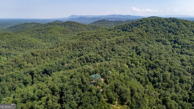 bird's eye view featuring a mountain view and a wooded view