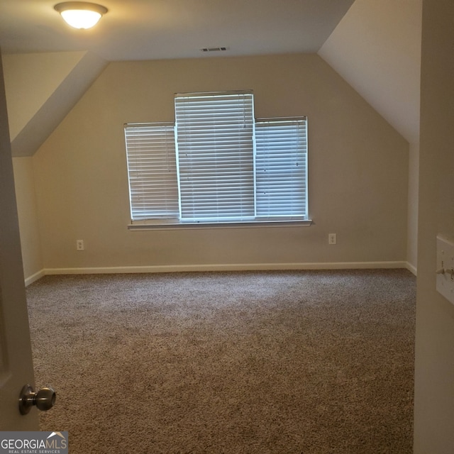 bonus room featuring carpet floors and lofted ceiling