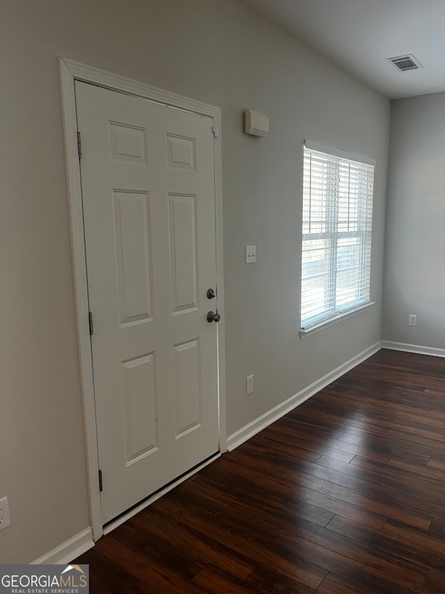 foyer entrance with dark hardwood / wood-style flooring