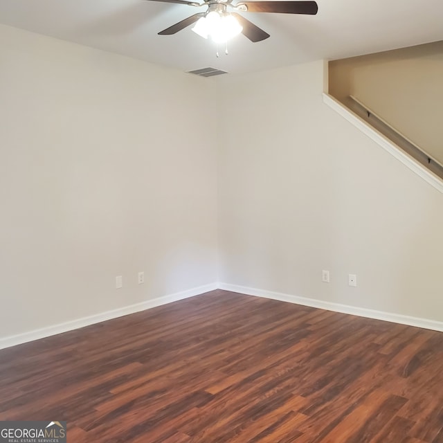 spare room featuring ceiling fan and hardwood / wood-style flooring