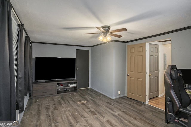 unfurnished office featuring ornamental molding, hardwood / wood-style floors, electric panel, and ceiling fan