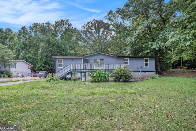 view of front of house featuring a deck and a front lawn