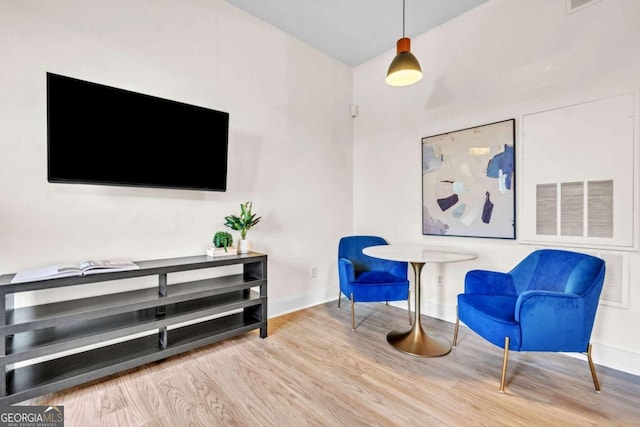 living area with hardwood / wood-style floors