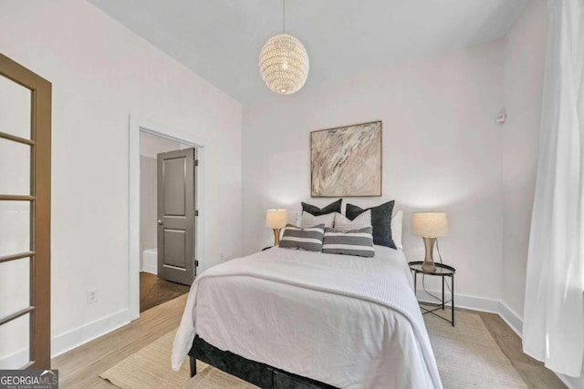 bedroom featuring wood-type flooring