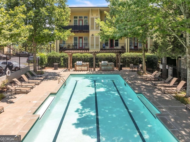 view of swimming pool with a patio area