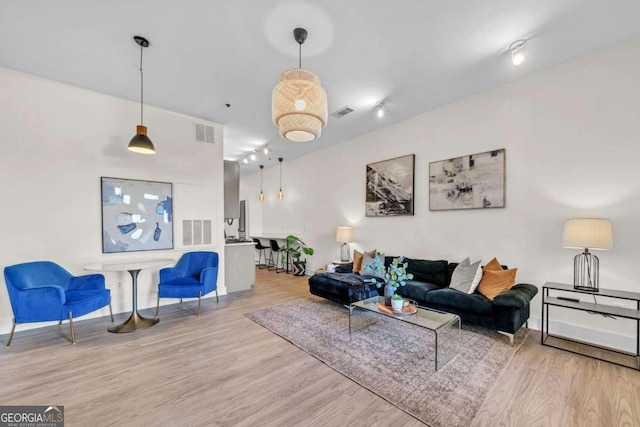 living room with light hardwood / wood-style floors