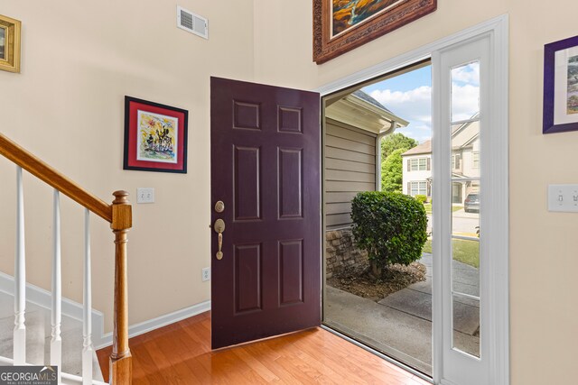 hallway featuring light colored carpet