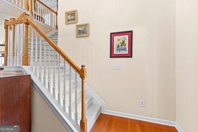 carpeted bedroom featuring a raised ceiling and crown molding