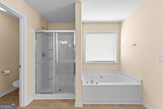 bathroom with tile flooring, dual vanity, and a washtub