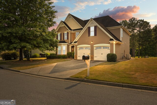 view of front facade featuring a front yard and a garage