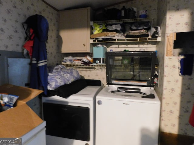 clothes washing area featuring washer and dryer