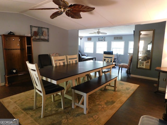 dining room featuring ceiling fan, dark hardwood / wood-style flooring, and lofted ceiling