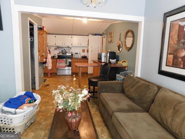 living room featuring lofted ceiling