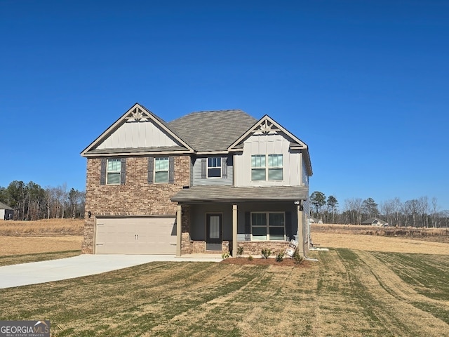 craftsman house with a front lawn and a garage